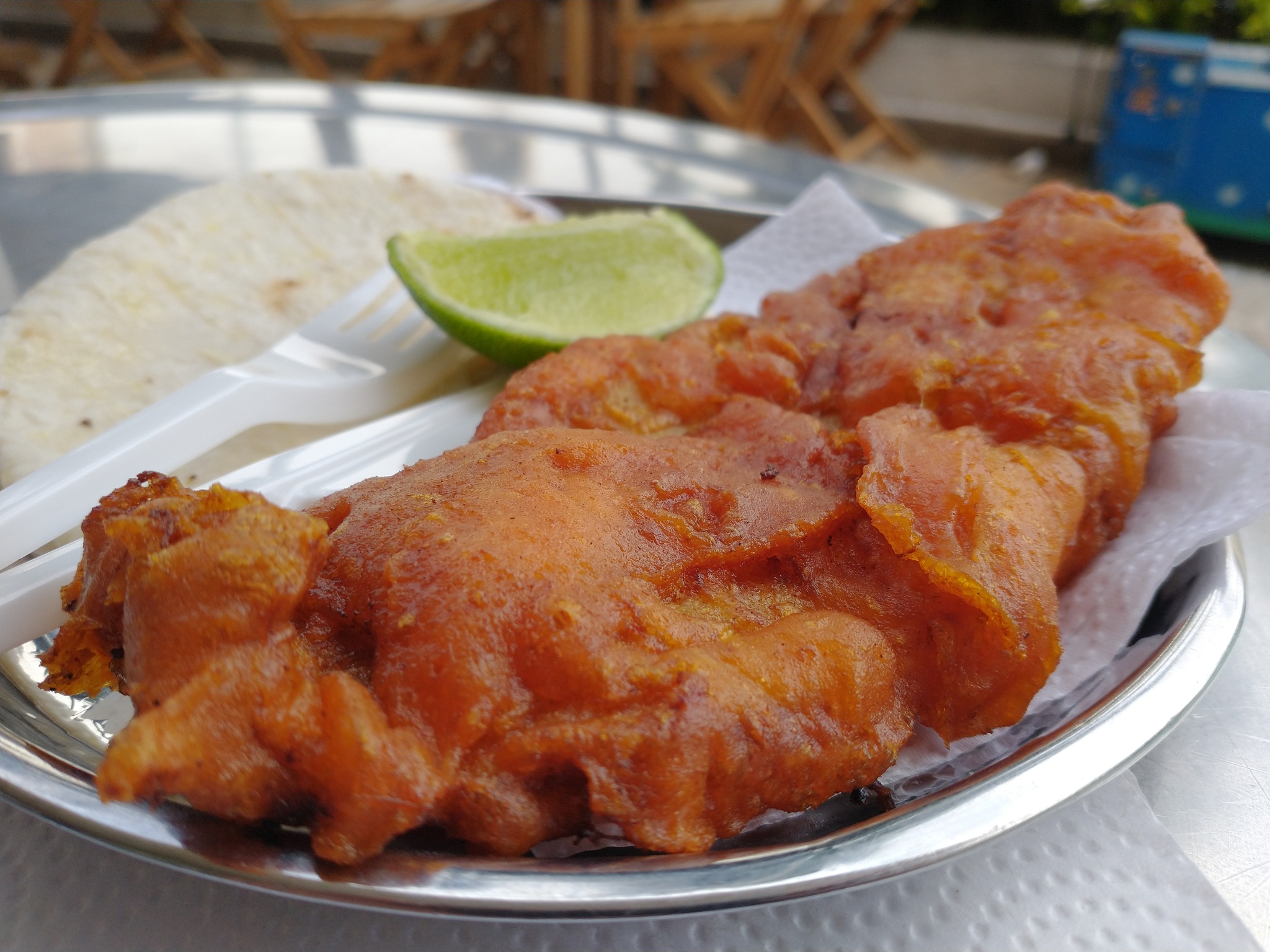 Batter and fried fish with lime.